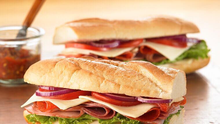 Spicy Italy Sandwich · Pepperoni, Genoa salami, hot butt capicola, provolone cheese, lettuce, tomatoes, red onion, pepperoncini, vinegar, olive oil and oregano, served on an Italian sub roll sandwich. COMBO COMES WITH YOU CHOICE ,POTATO SALAD,CIPS,MAC SALAD