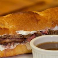 French Dip Au Jus Sandwich · Deluxe roast beef, melted Vermont yellow cheddar, pepperoncini, red onion and horseradish ma...