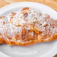 Almond Croissant · Our traditional Croissant dough filled with scratch-made Almond paste and soaked on Almond S...