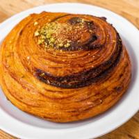 Raisin Roll · Artisan Roll made with traditional croissant dough and filled with our mix of raisins, touch...