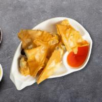 Cream Cheese Wonton · Deep-fried wonton wraps filled with cream cheese, carrot, onion, and celery. Served with our...
