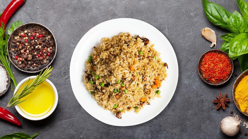 Combination Fried Rice · A meat combination of Chinese BBQ pork, beef, and chicken stir-fried with rice, egg, collard greens, bean sprouts, tomatoes, carrots, peas, and onions. Topped with cilantro, green onions, and black pepper.