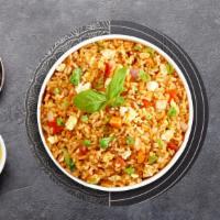 Thai Fried Rice · Stir-fried rice with egg, tomatoes, carrots, onions, and peas. Topped with cilantro, green o...