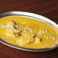 Korma · Muglai style dish, mildly spices, cooked with cream and yogurt, garnished with almonds and n...
