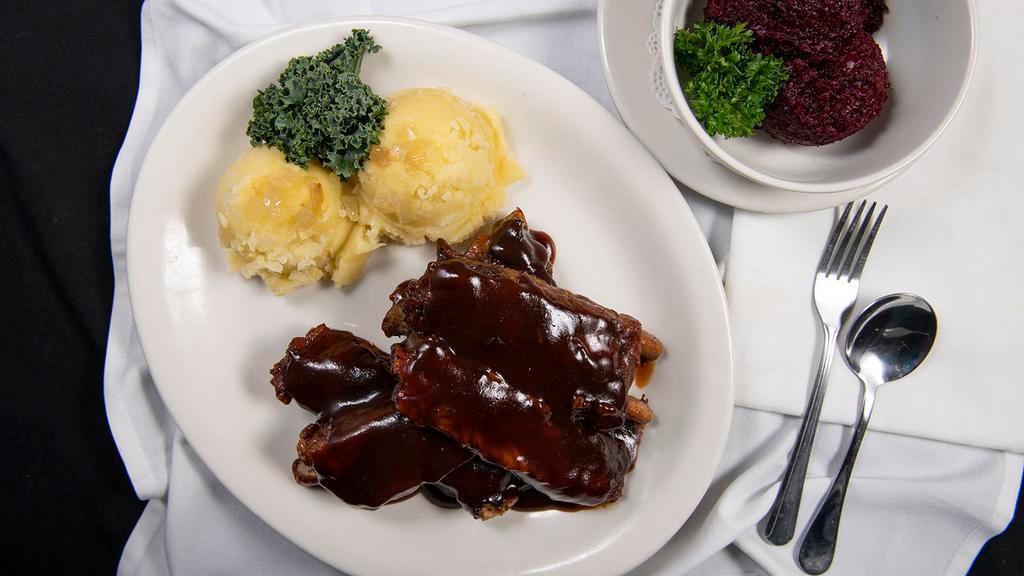 Zeberka · Fall off the bone pork ribs, marinated, smothered in our homemade BBQ sauce, and served with a side of beets