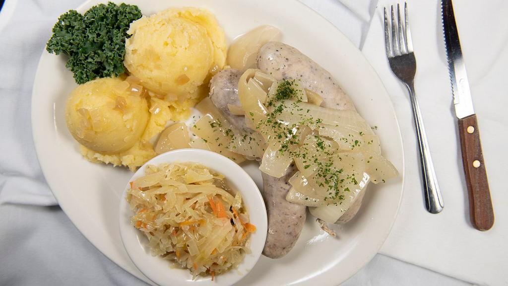 White Pork Sausage · Poached polish sausage, made in house, topped with caramelized onions. Served with your choice of sauerkraut or sweet Cabbage, a side of pickles and Lester's sweet and spicy mustard.