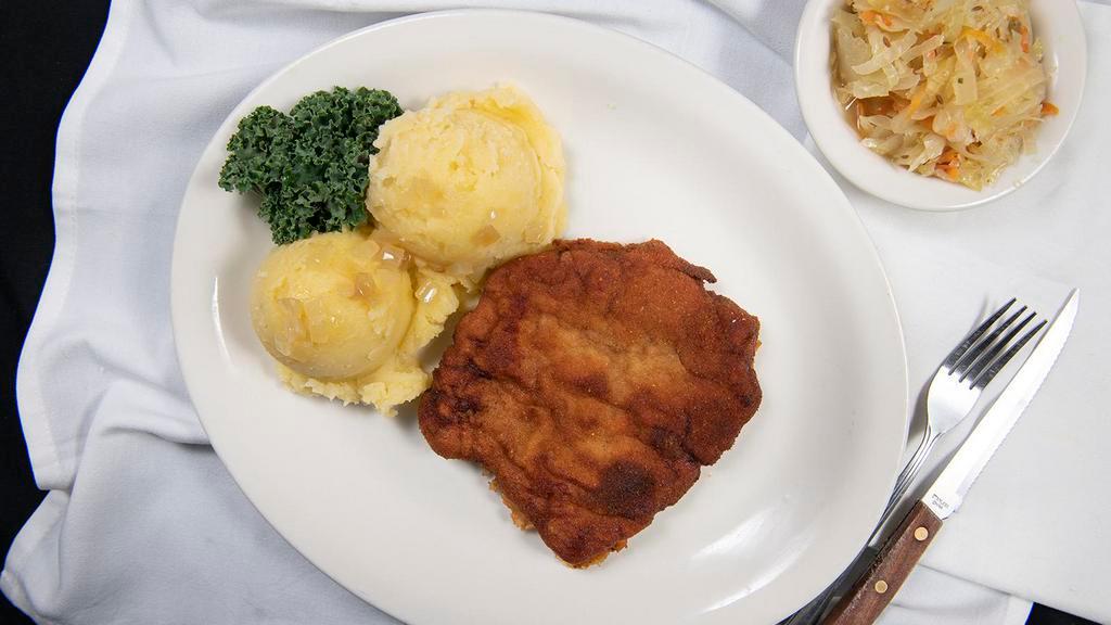 Schabowy · Boneless pork chop, breaded and pan fried, with your choice of sweet cabbage or sauerkraut