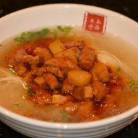 Shanghai Pork Wonton Soup · Seasend broth with filled wonton dumplings.