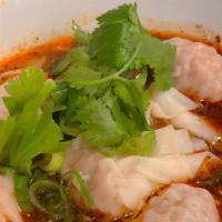Fish Wonton Soup · Seasend broth with filled wonton dumplings.