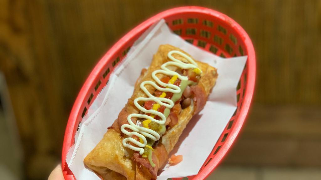 Mummy Dogo (Momia Dogo) · Hotdog stuffed with mozzarella cheese, then wrapped in a freshly made flour tortilla and bacon.