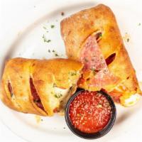 Baked Italian Sandwich · Filled with pepperoni, sausage, salami, and mozzarella. With a side of marinara sauce.