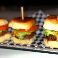 Sliders · 3 beef sliders with mayo, mustard, cheese, tomato , lettuce and pickles.
