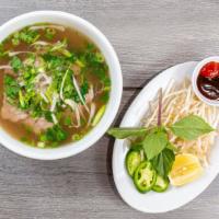 Steak Pho - Pho Tai · Our special broth made from beef bones. Served with bean sprouts, basil, cilantro, jalapeño,...
