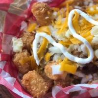 Youbetcha Basket · Choice of tots or fries, topped with red chili, cheddar fondue, shredded cheese, diced onion...