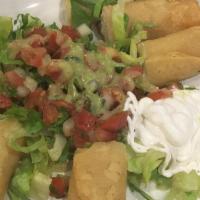 Taquitos (Chicken Or Potato) · Cabbage/lettuce, sour cream & salsa.