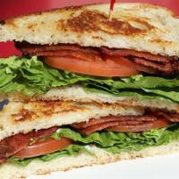 Grilled Blt · Bacon, lettuce, tomato, and mayonnaise on rustic white bread