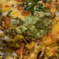 Super Nachos With Meat · Corn tortilla chips with refried beans, choice of ground beef or chicken, melted cheese, cho...