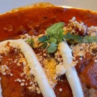 Chile Relleno · Cheese stuffed poblano chile topped with mild red sauce and cotija cheese.