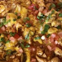 Arroz Con Pollo · Boneless chicken breast sautéed with mushrooms in our special enchilada sauce with diced tom...