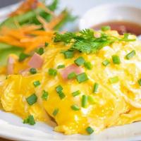 Omelette · Four egg omelet with cheddar and a side.