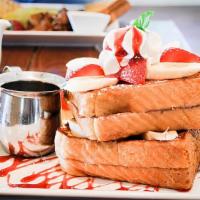 Stuffed French Toast · Our classic French toast, stuffed with whipped cream cheese, quartered, dusted with cinnamon...