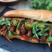 Grilled Chicken Bánh Mì / Bánh Mì Gà Nướng · Marinated grilled chicken, pickled carrots & daikon slaw, cucumbers, slice jalapeños, and ci...