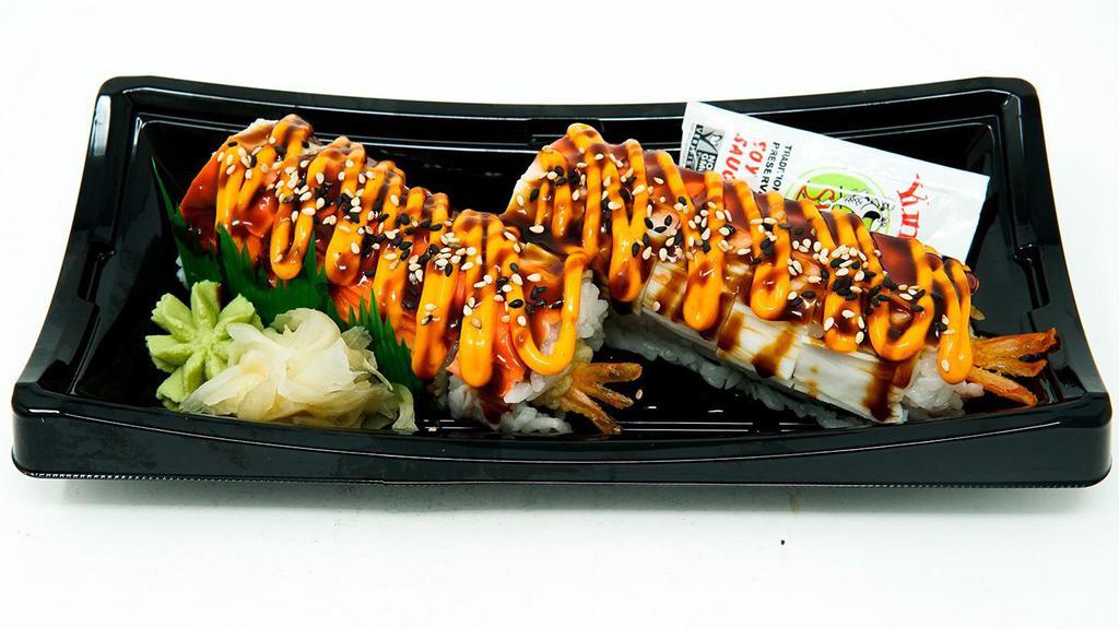 Temptation Roll (10 Pc) · Tempura style shrimp, avocado, cucumber rolled in sushi rice and seaweed. Topped with shredded imitation crab stick, Yummi Spicy Mayo, Yummi Sushi Sauce and sesame seeds.