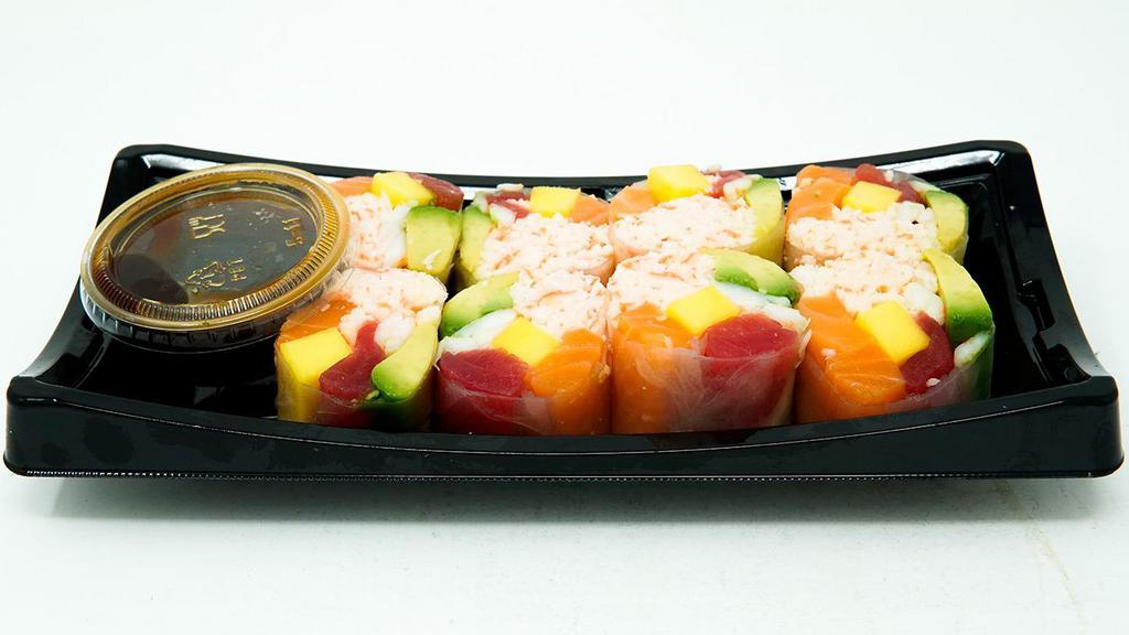 Caribbean Roll · Imitation crab salad, avocado, mango, tuna, salmon and cooked shrimp rolled in rice paper. Served with Yummi Ponzu Sauce.