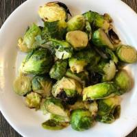 Roasted Brussels Sprouts · Farm Fresh Brussels Sprouts Tossed with Olive Oil, Herbs & oven roasted.