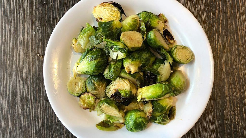 Roasted Brussels Sprouts · Farm Fresh Brussels Sprouts Tossed with Olive Oil, Herbs & oven roasted.