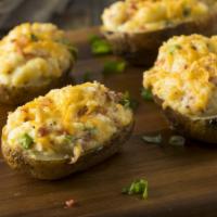 Twice Baked Potato - Cold · Potato Skin, Whipped Potatoes, Cheddar Cheese, Sour Cream, Bacon & Chives.