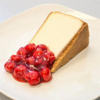 Cheesecake Slice · Creamy cheesecake slice with graham cracker crust.  Plain or Cherry topping!