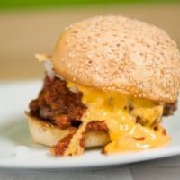 Chili Burger · 1/3LB Hand-Made Lean USDA Beef, Homemade chili, cheddar cheese sauce and onions. Served on a...