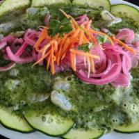 Aguachile Bajamar · Uncooked butterflied shrimp marinated in lime juice & a habanero beet sauce, over a bed of c...
