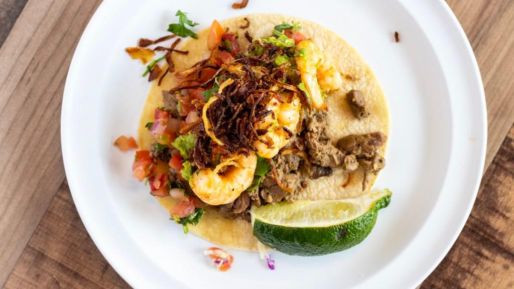 Surf N Turf Taco · Grilled shrimp and grilled steak topped with pico de gallo, guacamole and fried onion strings.