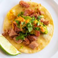 La Paz Taco (Taco Of The Month) · Spicy. Carnitas style smoked marlin, garnished with cilantro and pickled onions, topped with...