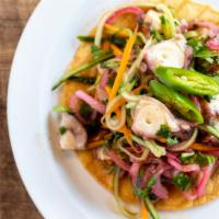 Kraken Tostada · Octopus with lime juice, soy sauce, sesame oil, pickled onions, cilantro, serrano chile, sha...