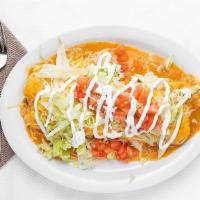 Smothered Burrito · Flour tortilla filled with rice, beans and your choice of meat. Smothered with green chili a...