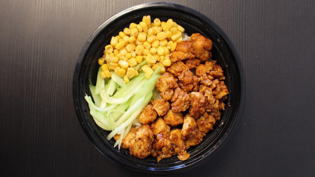Crispy Black Pepper Chicken Rice Bowl 黑椒炸鸡饭 · Spicy. Crispy fried chicken with black pepper sauce over rice. Side with corns and cucumbers.