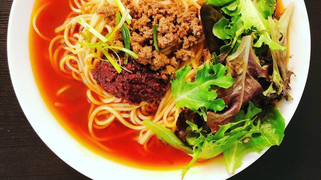 Chongqing Soup Ramen 重庆面 · Spicy. Authentic spicy soup noodle. The soup based on soy sauce and premium Sichuan chili oil.
Topping with beef sauce, and green onion, fresh greens, bamboo shoots, corn, chili paste.