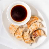 Pot Stickers (6 Pieces) · Pan Fried Pot Stickers
handmade with ground pork and season  diced up fresh vegetables.
Serv...