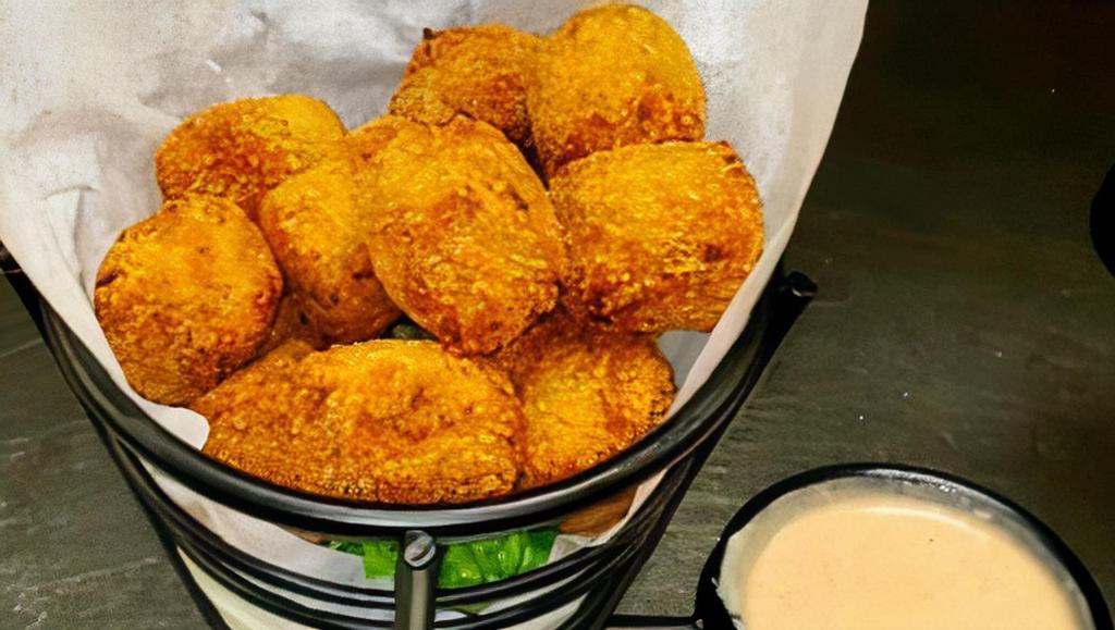 Boudin Balls · Our Louisiana seasoned mixture of pork, Cajun spices and rice served with remoulade sauce.
