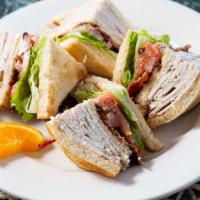 Clubhouse · Triple decker roasted turkey, bacon, lettuce and tomato on toasted bread. Add cheese or avoc...