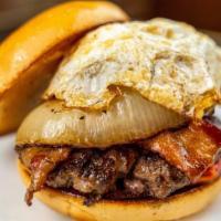 The 12Th Man Burger · Fried egg, applewood bacon, mama Lil's peppers, caramelized onions, jalapeño cream cheese an...