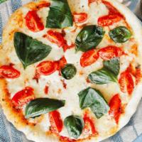 Classic Margarita Pizza · Homemade pizza sauce, fresh mozzarella cheese, and basil baked on hand-tossed dough.