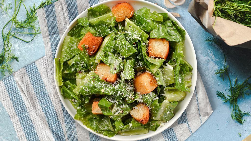 Caesar Salad · Romaine lettuce, croutons, lemon, and parmesan tossed with caesar dressing.