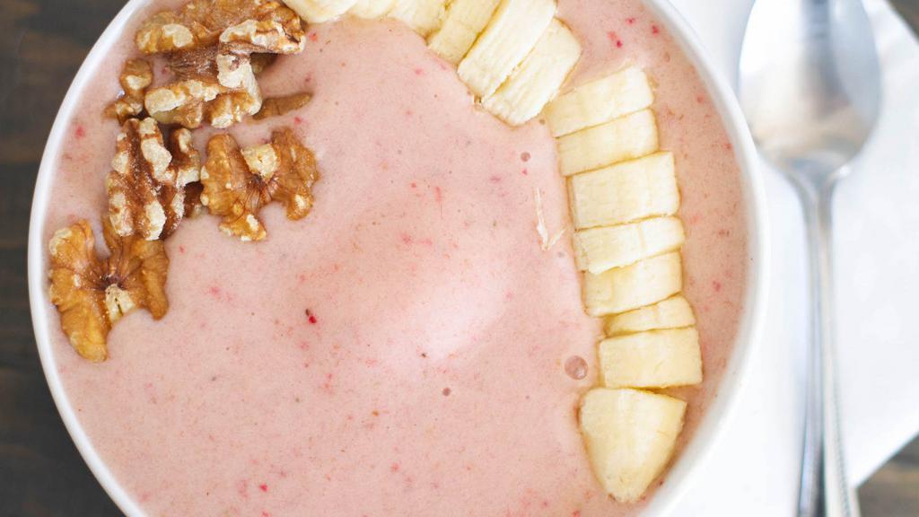 Strawberry Fields · Strwaberries, bananas, almond milk, grapes topped with chia seeds and shredded coconut.
