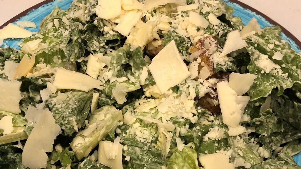 Caesar Day · Romaine lettuce, shaved parmesan and croutons tossed in our house-made Caesar dressing.