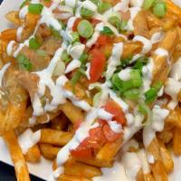 Chile Cheese Fries · Pork green chile, Odell’s Rupture IPA spicy queso, tomato, fresh roasted jalapeno, green oni...