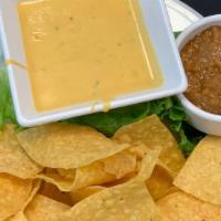 Chips And Queso · House fried tortilla chips with our spicy Odell’s Rupture IPA spicy queso. add salsa for an ...